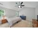 Cozy bedroom featuring a ceiling fan, soft carpet, and neutral paint at 7344 Maitland Ln, Charlotte, NC 28215