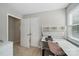 Bright bedroom showcasing neutral walls, closet, and a desk area, ideal for work and relaxation at 7344 Maitland Ln, Charlotte, NC 28215