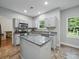 Well-lit kitchen featuring an island, granite countertops and stainless steel appliances at 7344 Maitland Ln, Charlotte, NC 28215