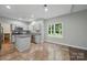 Well-lit kitchen with stainless steel appliances, granite countertops, and neutral cabinets at 7344 Maitland Ln, Charlotte, NC 28215