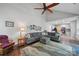 Spacious living room featuring vaulted ceilings, a ceiling fan, and an open floor plan at 7344 Maitland Ln, Charlotte, NC 28215
