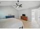 Bright main bedroom features neutral walls, vaulted ceilings with ceiling fan, and ensuite access at 7344 Maitland Ln, Charlotte, NC 28215