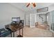 Well-lit office space with a ceiling fan and ample room for a large desk and multiple monitors at 7344 Maitland Ln, Charlotte, NC 28215