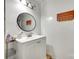 Well-lit bathroom with a white vanity, oval mirror, and neutral-toned walls and accessories at 739 Springdale Rd, Rock Hill, SC 29730