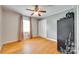 Empty bedroom featuring hardwood floors, a double closet, and modern color accents at 739 Springdale Rd, Rock Hill, SC 29730