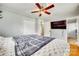 Comfortable bedroom showcasing a television, wooden floors, closet, and bathroom access at 739 Springdale Rd, Rock Hill, SC 29730