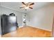 Hardwood floor bedroom with a security safe and doorway access to another room at 739 Springdale Rd, Rock Hill, SC 29730