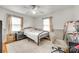 Bright bedroom featuring a black metal bed frame, neutral decor, and hardwood flooring at 739 Springdale Rd, Rock Hill, SC 29730