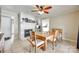 Cozy dining area featuring a fireplace and a modern ceiling fan with light fixtures at 739 Springdale Rd, Rock Hill, SC 29730