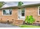 Inviting front door adorned with a floral wreath and brick steps at 739 Springdale Rd, Rock Hill, SC 29730