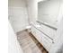 A bright bathroom features a granite countertop, white cabinets, and tub with shower, offering a clean, modern aesthetic at 7601 Hammond Dr, Charlotte, NC 28215