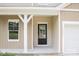 Inviting entryway featuring a black front door, white trim, and a large window for natural light at 7601 Hammond Dr, Charlotte, NC 28215