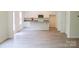 Bright and airy living room with hardwood floors, white cabinets, and plenty of natural light at 7601 Hammond Dr, Charlotte, NC 28215