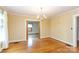 Dining room with patterned walls, hardwood floors, and chandelier at 761 Milton Ave, Rock Hill, SC 29730