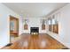 Living room featuring fireplace, hardwood floors, and bright windows at 761 Milton Ave, Rock Hill, SC 29730
