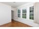 Bright living room with three windows allowing natural light to illuminate the space at 761 Milton Ave, Rock Hill, SC 29730