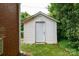 A white shed is nestled in the back yard at 761 Milton Ave, Rock Hill, SC 29730