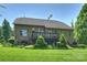 Back of the house featuring a spacious outdoor wood deck, lawn and mature trees at 7916 Deerbridge St, Mint Hill, NC 28227