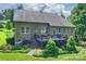 Back of the house featuring a spacious outdoor wood deck, lawn and mature trees at 7916 Deerbridge St, Mint Hill, NC 28227