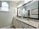 Stylish bathroom featuring double sinks with granite countertops, and large mirrors at 7916 Deerbridge St, Mint Hill, NC 28227