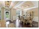 Formal dining area featuring elegant chandelier, wainscoting and a large window at 7916 Deerbridge St, Mint Hill, NC 28227