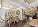 Elegant dining room with decorative ceiling, chandelier, and open access to the living room at 7916 Deerbridge St, Mint Hill, NC 28227
