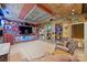 Home entertainment room featuring rustic decor, wood ceiling, and built-in shelving at 7916 Deerbridge St, Mint Hill, NC 28227