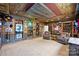Inviting entertainment room with detailed decor, comfy seating, and custom shelving at 7916 Deerbridge St, Mint Hill, NC 28227