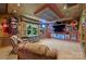 Finished entertainment room with wood-paneled ceiling and Carolina Panthers decor at 7916 Deerbridge St, Mint Hill, NC 28227