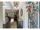 Welcoming foyer features hardwood floors, elegant decor, and a view into the cozy living room at 7916 Deerbridge St, Mint Hill, NC 28227