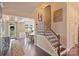 Elegant foyer with hardwood floors, staircase, and dining area visible in the background at 7916 Deerbridge St, Mint Hill, NC 28227