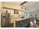Modern kitchen featuring white cabinets, stone island, and stainless steel appliances at 7916 Deerbridge St, Mint Hill, NC 28227