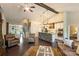 Spacious living room featuring a stone kitchen island, hardwood floors, and an open layout at 7916 Deerbridge St, Mint Hill, NC 28227