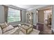 Cozy living area with hardwood floors, designer coffee table, and classic decor at 7916 Deerbridge St, Mint Hill, NC 28227
