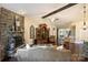 Living room with stone fireplace, hardwood floors, and an open layout to the entryway at 7916 Deerbridge St, Mint Hill, NC 28227