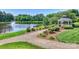 Scenic view of a pond with a charming gazebo, enhancing the outdoor appeal of the community at 7916 Deerbridge St, Mint Hill, NC 28227