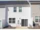 Back of home with windows, sliding glass door, and exterior siding at 8177 Sheffield Dr, Terrell, NC 28682