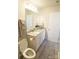 Bright bathroom with a granite vanity, tile floor, and ample storage space at 8177 Sheffield Dr, Terrell, NC 28682