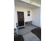The inviting front entrance features stylish stone accents and a decorative wreath on the black door at 8177 Sheffield Dr, Terrell, NC 28682