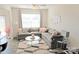 The living room features a large gray sectional sofa, decorative pillows and a modern rug at 8177 Sheffield Dr, Terrell, NC 28682