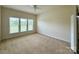 Bright bedroom with large windows and neutral carpet at 8429 Olde Stonegate Ln, Mint Hill, NC 28227