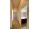 Hallway showing bathroom vanity with undermount sink and tile flooring at 8429 Olde Stonegate Ln, Mint Hill, NC 28227