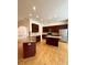 Spacious kitchen featuring two islands, stainless steel appliances, and dark wood cabinetry at 8429 Olde Stonegate Ln, Mint Hill, NC 28227