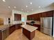 Well-equipped kitchen boasting stainless steel appliances, granite countertops, and a functional island at 8429 Olde Stonegate Ln, Mint Hill, NC 28227