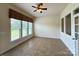 Bright sunroom with large windows offering a view of the backyard at 8429 Olde Stonegate Ln, Mint Hill, NC 28227