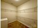 Spacious walk-in closet with wire shelving for ample storage at 8429 Olde Stonegate Ln, Mint Hill, NC 28227