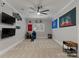 Spacious bonus room with sports memorabilia, a large screen TV, and neutral carpeting at 8433 Cheverny Dr, Waxhaw, NC 28173