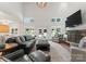 Bright living room features a stone fireplace, hardwood floors, and French doors leading to the backyard at 8433 Cheverny Dr, Waxhaw, NC 28173