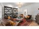 Comfortable living room with leather chairs, ottoman, and elegant decor at 8433 Cheverny Dr, Waxhaw, NC 28173