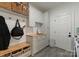 Well-organized mudroom with cabinets, seating, and ample storage at 8433 Cheverny Dr, Waxhaw, NC 28173